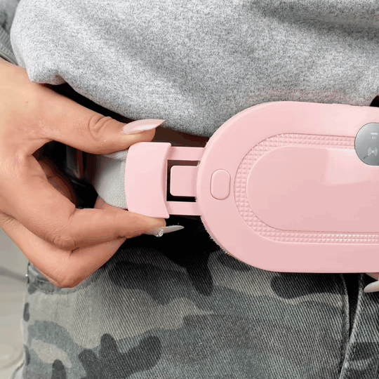 Position the pad against your lower abdomen. Secure the adjustable...